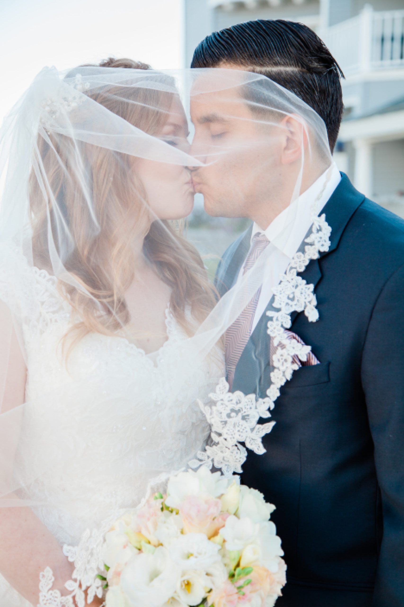 Bride and groom kissing at The Inn at Laguna Beach Wedding