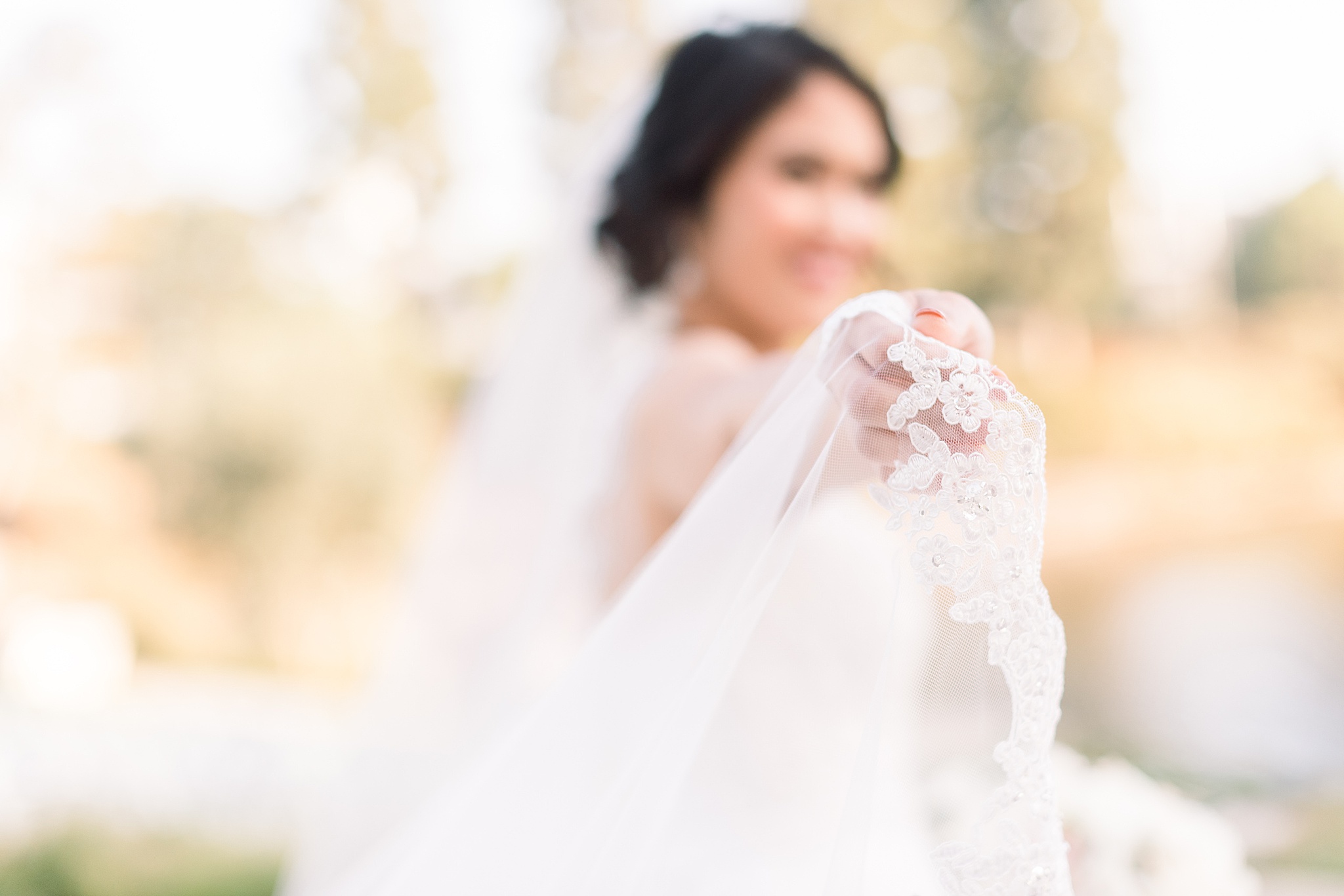 Bride holding veil at The Ranch at Laguna Beach Wedding
