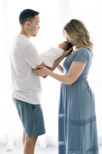 Parents kissing newborn baby born at Mission Hospital, Women's Wellness Center
