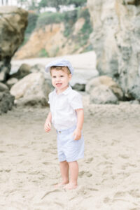 Young dapper boy poses for a photo in Laguna Beach, California.