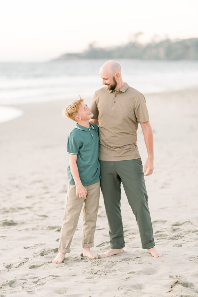 Father and Son smile together during a family mini session taken by Amy Captures Love