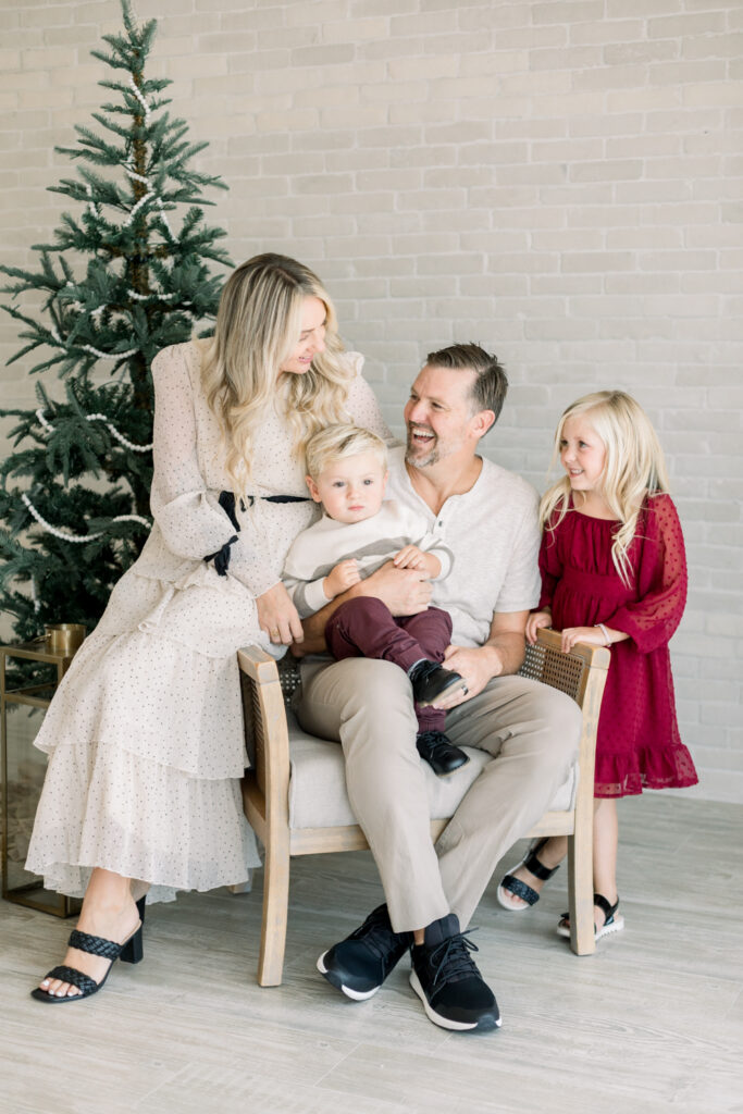 Family poses for Christmas Card photos in Orange County with Amy Captures Love